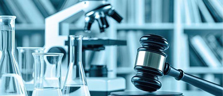 Concept - Scientific lab equipment next to judge's gavel - © anika stock.adobe.com